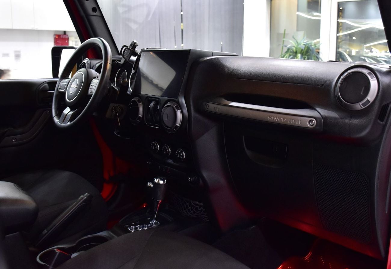 Jeep Wrangler SPORT EXCELLENT DEAL for our Jeep Wrangler Sport ( 2017 Model ) in Red Color GCC Specs