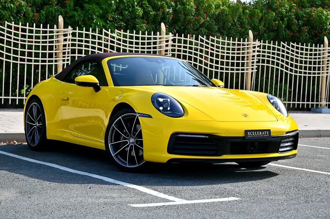 Porsche 911 CARRERA Cabriolet | Racing Yellow / Brown Roof | 379 HP | 989 KM | Warranty