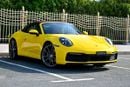 Porsche 911 CARRERA Cabriolet | Racing Yellow / Brown Roof | 379 HP | 989 KM | Warranty
