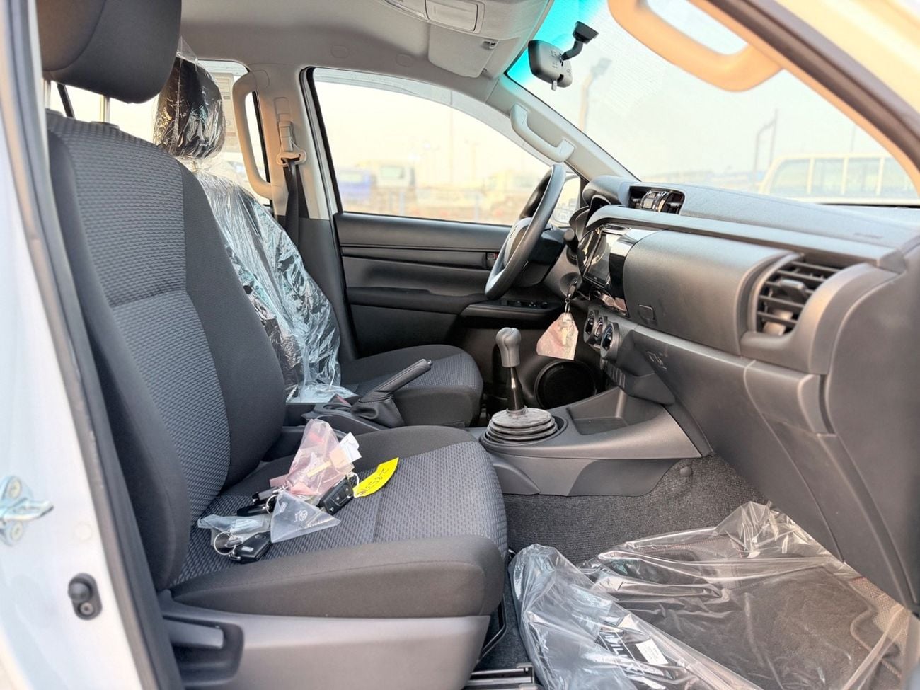 Toyota Hilux DLX 2026 Toyota Hilux 2.4L Diesel 4WD Double Cab Pickup, equipped with a manual transmission. Powered by