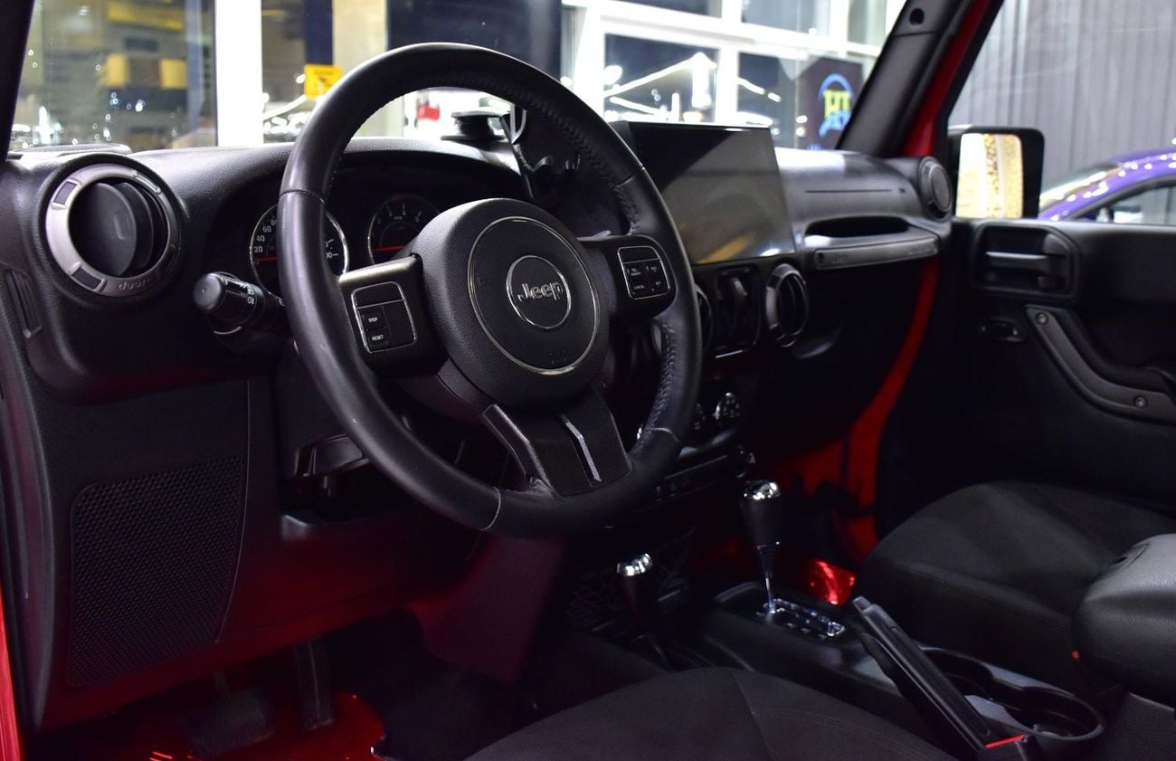 Jeep Wrangler SPORT EXCELLENT DEAL for our Jeep Wrangler Sport ( 2017 Model ) in Red Color GCC Specs
