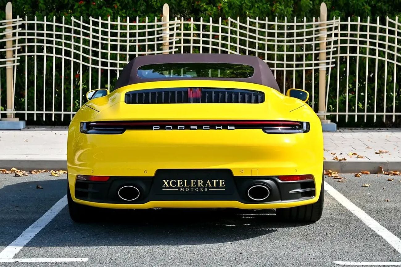 Porsche 911 CARRERA Cabriolet | Racing Yellow / Brown Roof | 379 HP | 989 KM | Warranty