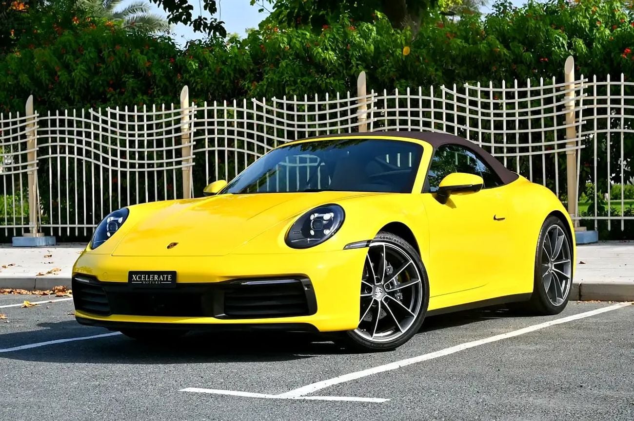 Porsche 911 CARRERA Cabriolet | Racing Yellow / Brown Roof | 379 HP | 989 KM | Warranty