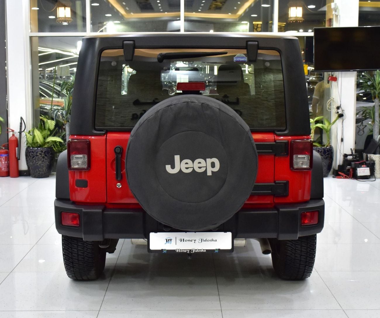 Jeep Wrangler SPORT EXCELLENT DEAL for our Jeep Wrangler Sport ( 2017 Model ) in Red Color GCC Specs