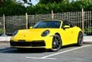 Porsche 911 CARRERA Cabriolet | Racing Yellow / Brown Roof | 379 HP | 989 KM | Warranty
