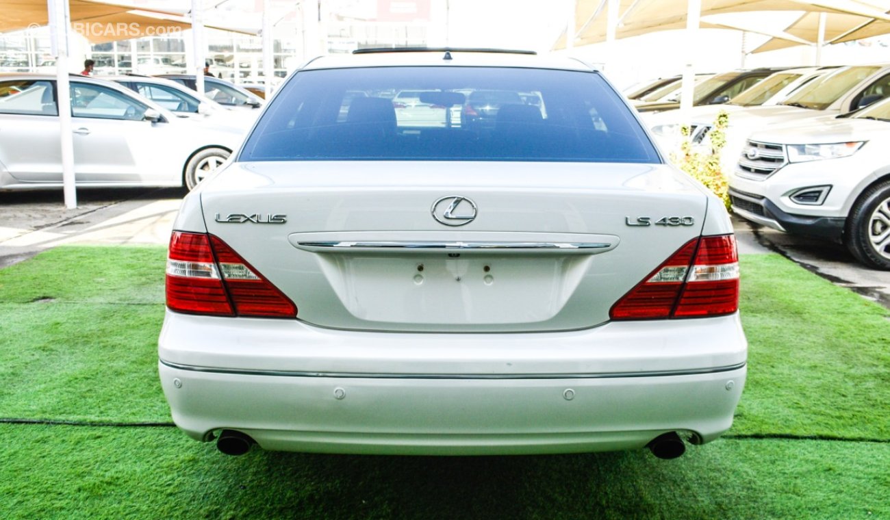 Lexus LS 430 Imported 1/2 Ultra 2006 model, white color, leather opening, wood wheels, electric mirrors, electric