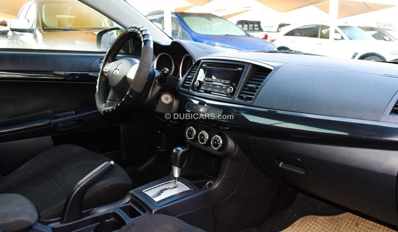 Mitsubishi Lancer 1600 CC, 2016 model, Gulf silver color, rear wing hatch, alloy wheels, FM radio, power conditioning,