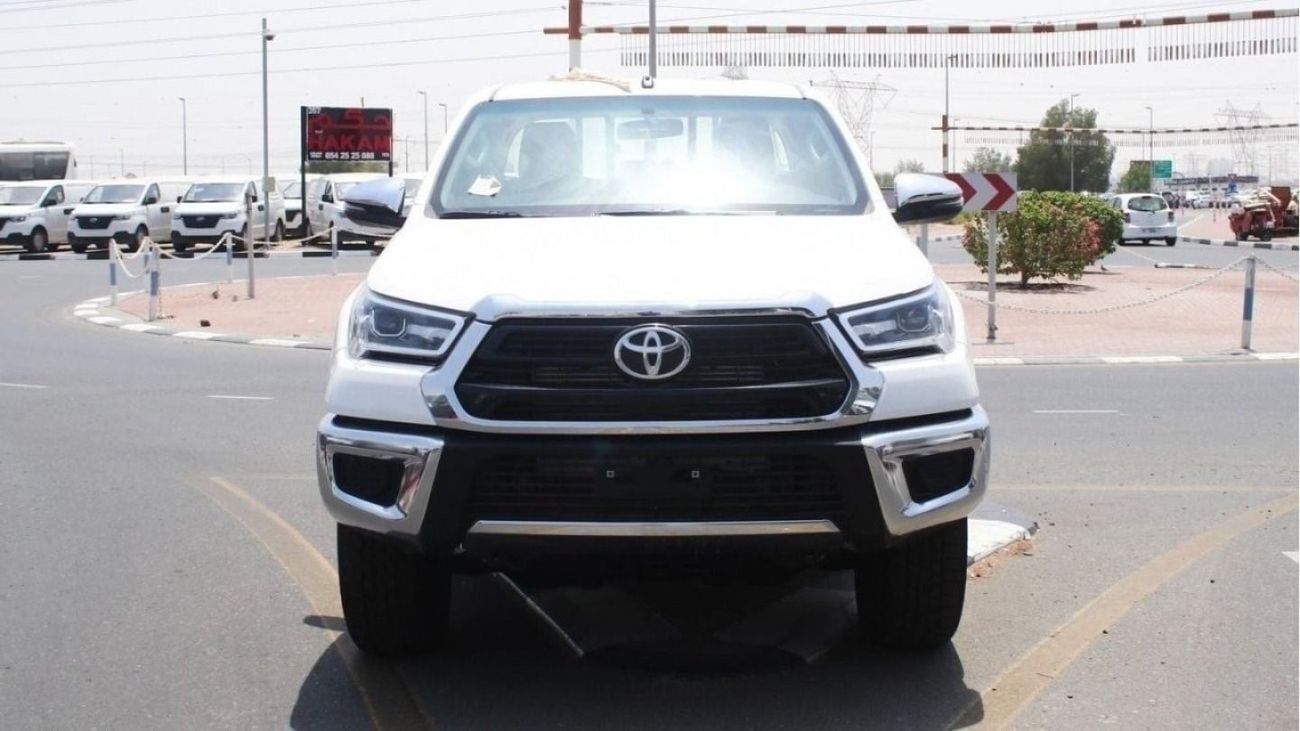 Toyota Hilux 2.4L diesel  . White 2025 model, M/T Wide body with Chrome bumper