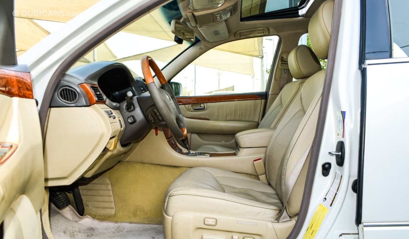 Lexus LS 430 Imported 1/2 Ultra 2006 model, white color, leather opening, wood wheels, electric mirrors, electric