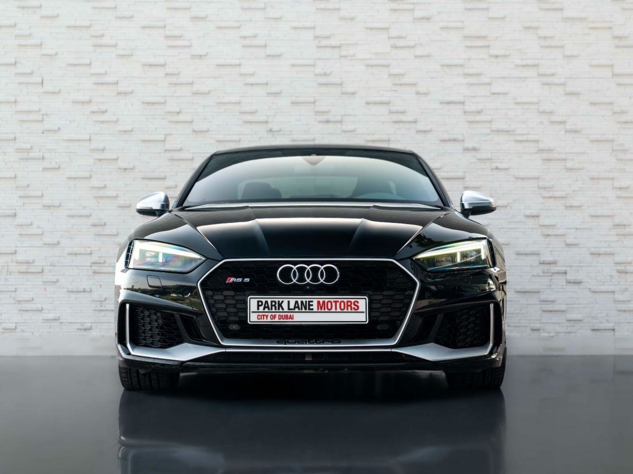 Close-up of the Audi RS5 Coupe’s rear, highlighting its LED taillights and sculpted bumper