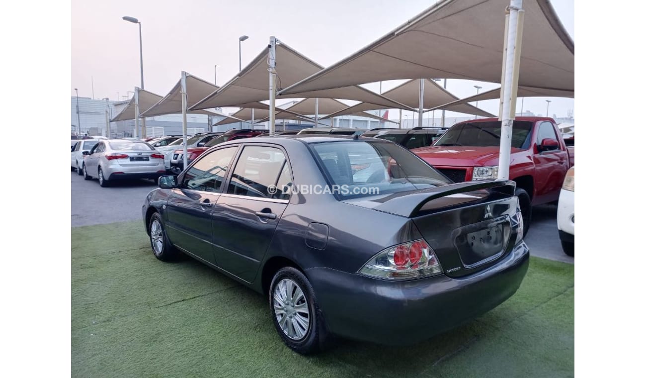 ميتسوبيشي لانسر خليجي 2009 تكييف باورأوتوماتيك سنتر لوك جناح خلفى بحالة ممتازة جدا لاتحتاج الي أى مصاريف