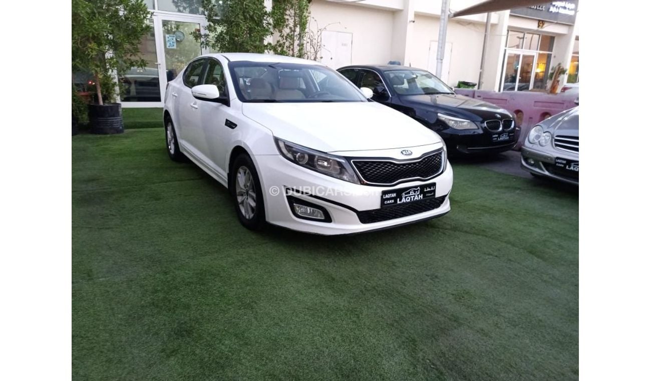 كيا أوبتيما خليجي 2014 لون ابيض داخل بيج رقم 2 رنجات  أنوار ضباب راديو FM مثبت سرعه حساسات لاتحتاج الي مصاريف