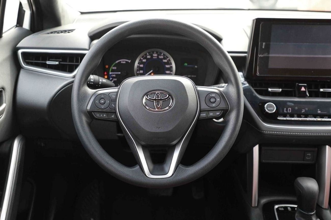 تويوتا كورولا كروس 2025 TOYOTA COROLLA CROSS MID 1.8 Hybrid - PLATINUM WHITE PEARL inside RED | Export Only