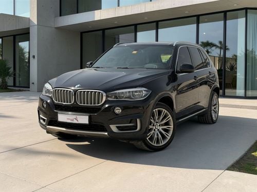 BMW X5 50i Exclusive 4.4L (7 Seater) BMW X5 XDRIVE 50i | 4.4L TWIN TURBO V8 – 450 BHP | 2014 | GCC SPECS