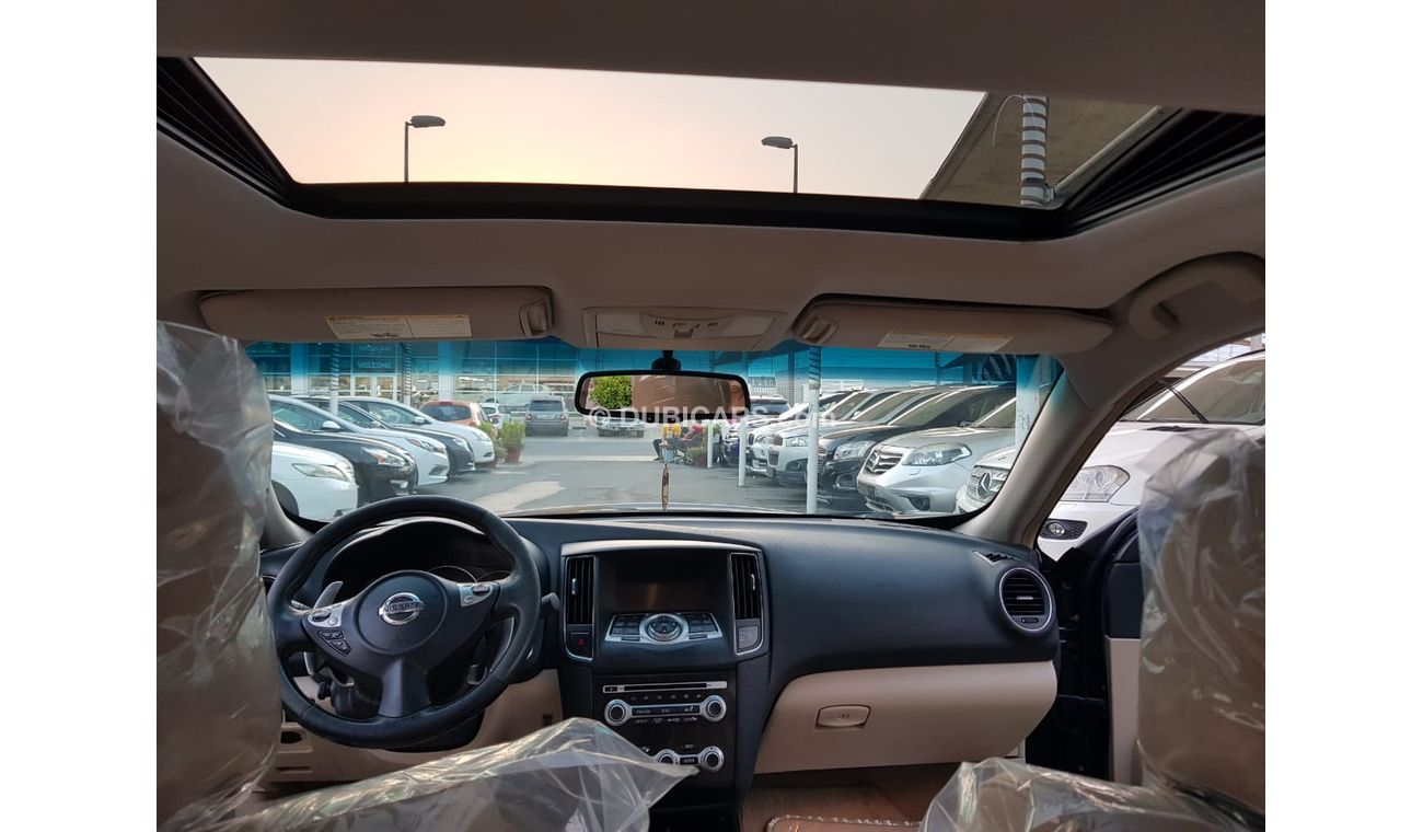 Nissan Maxima GCC Number One - Full Option - sunroof - Leather - Back Wing - Screen - Sensors -Excellent condition