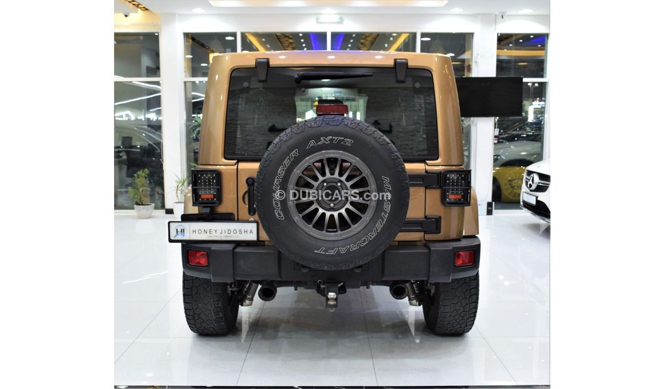 Jeep Wrangler Sahara EXCELLENT DEAL for our Jeep Wrangler UNLIMITED SAHARA 4x4 ( 2015 Model! ) in Brown Color! GCC