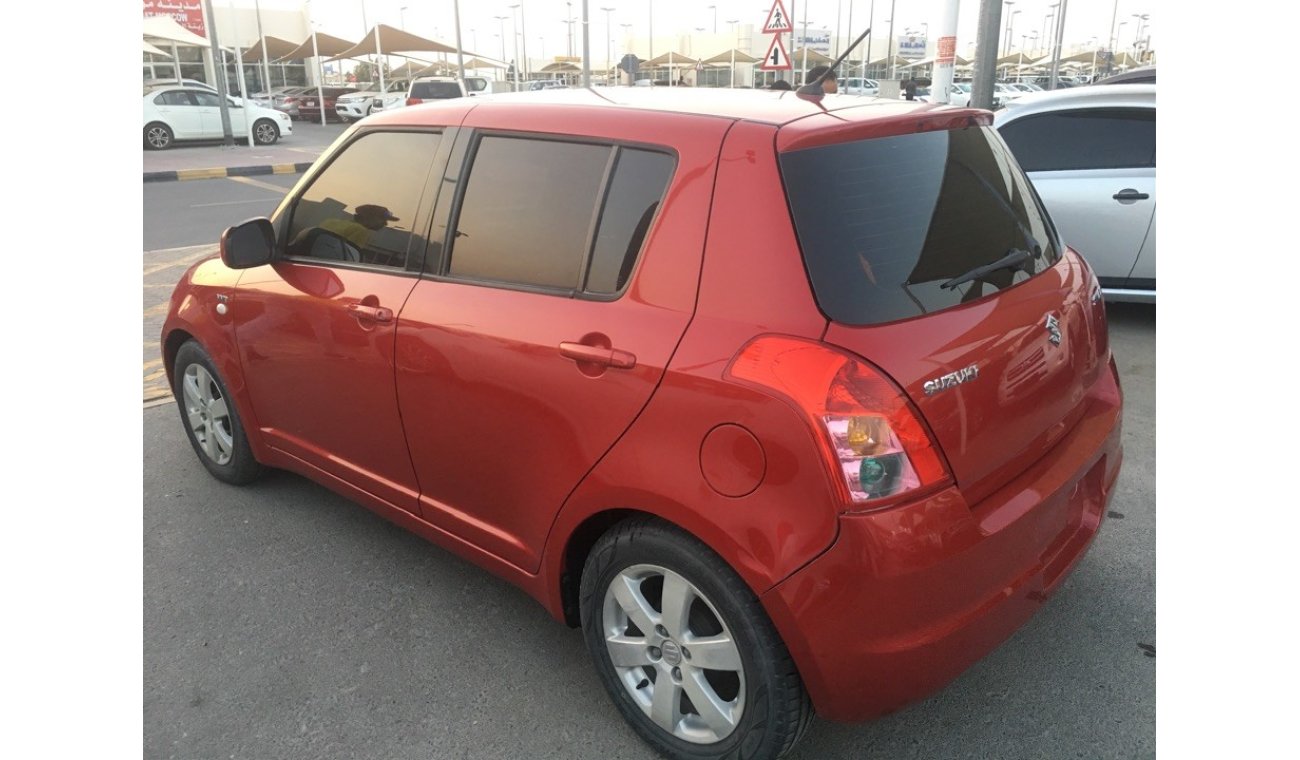 Suzuki Swift clean from the agency's first owner 2009 red color