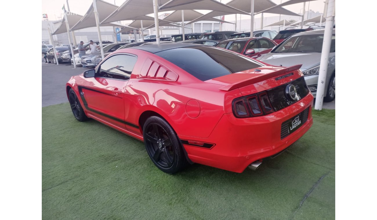 Ford Mustang 2014 GCC model, coupe, cruise control, rear camera, leather rear spoiler, in excellent condition