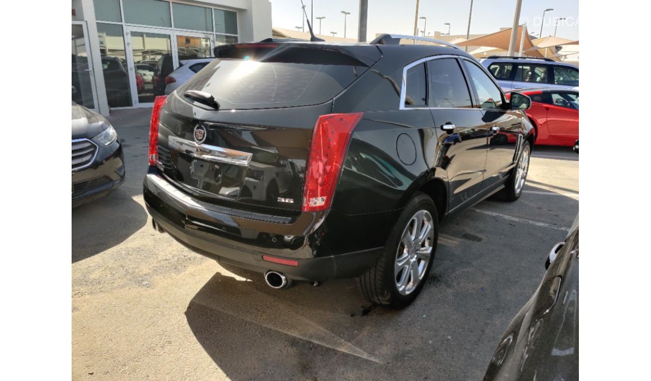 كاديلاك SRX 2014 model GCC specs full options panorama clean car 3.6ltr