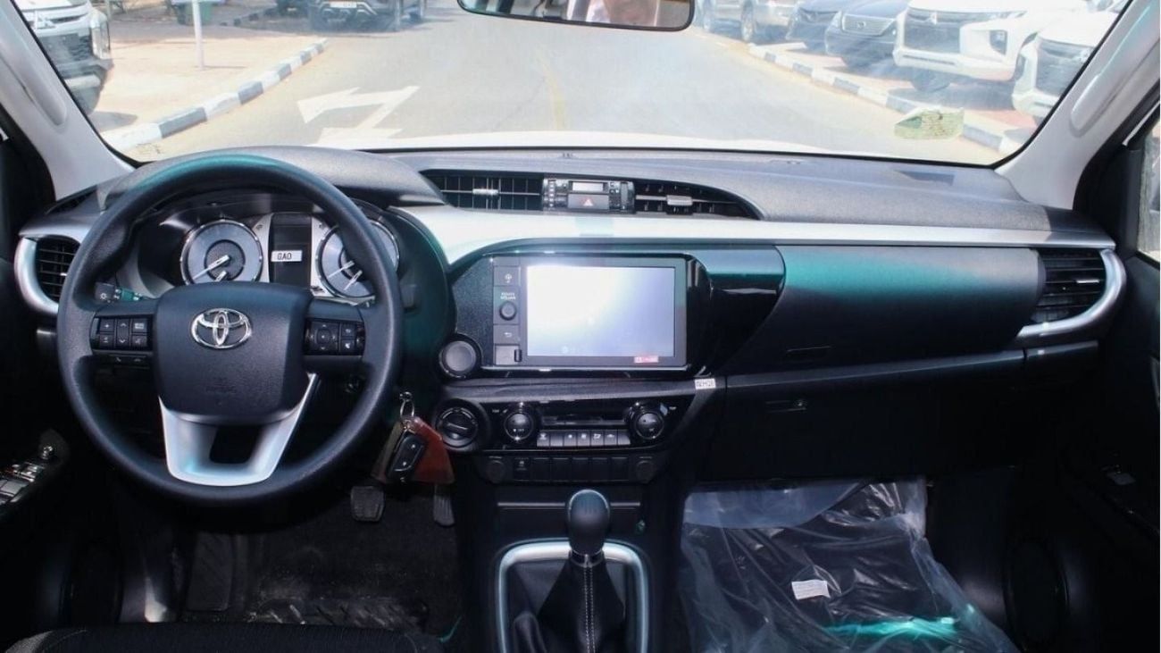 Toyota Hilux 2.4L diesel  . White 2025 model, M/T Wide body with Chrome bumper