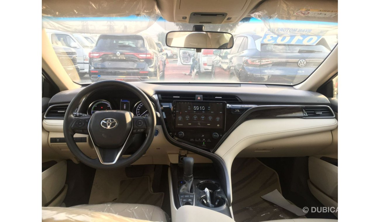 تويوتا كامري LE تويوتا كامري LE (AXVH71) 2.5 لتر سيدان هجين دفع أمامي 4 أبواب لون أبيض 2020 موديل دفع بدء ناقل حر