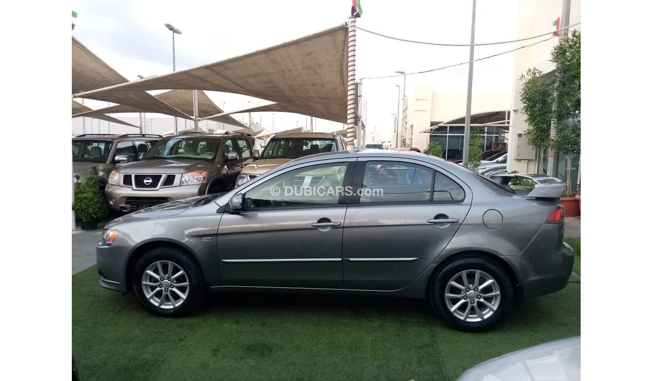 Mitsubishi Lancer Gulf gray color, inside beige without accidents, rear wing sensors, fog lights, in excellent conditi