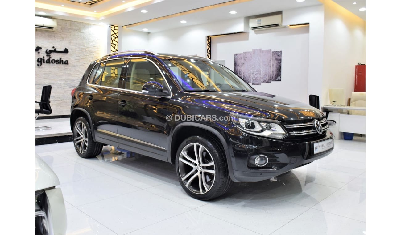 Volkswagen Tiguan SEL EXCELLENT DEAL for our Volkswagen Tiguan 2.0 TSi 4Motion ( 2014 Model! ) in Black Color! GCC Spe