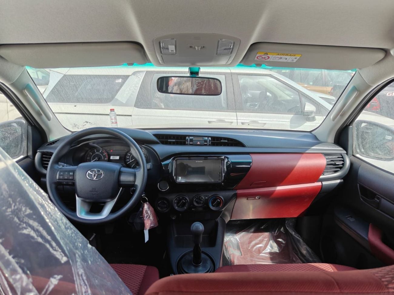 تويوتا هيلوكس 2026 Toyota Hilux white/red 2.4L diesel manual GCC spec mid option