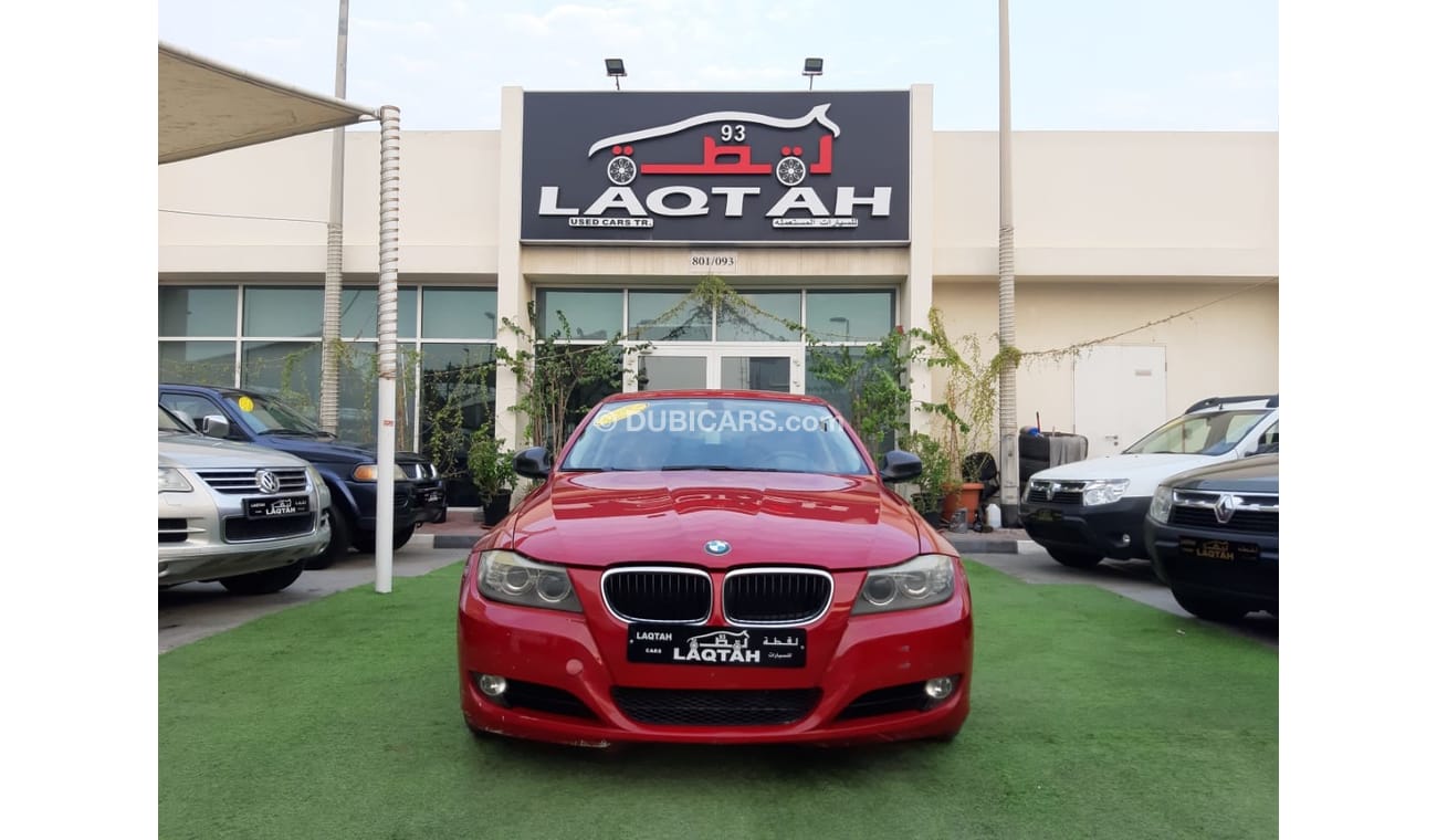 BMW 320i i Gulf Specs Red Color 2009 model in good condition