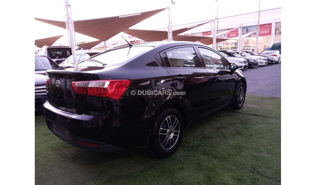 Kia Rio Gulf model 2013, black color, without accidents, wheels in excellent condition, you do not need any