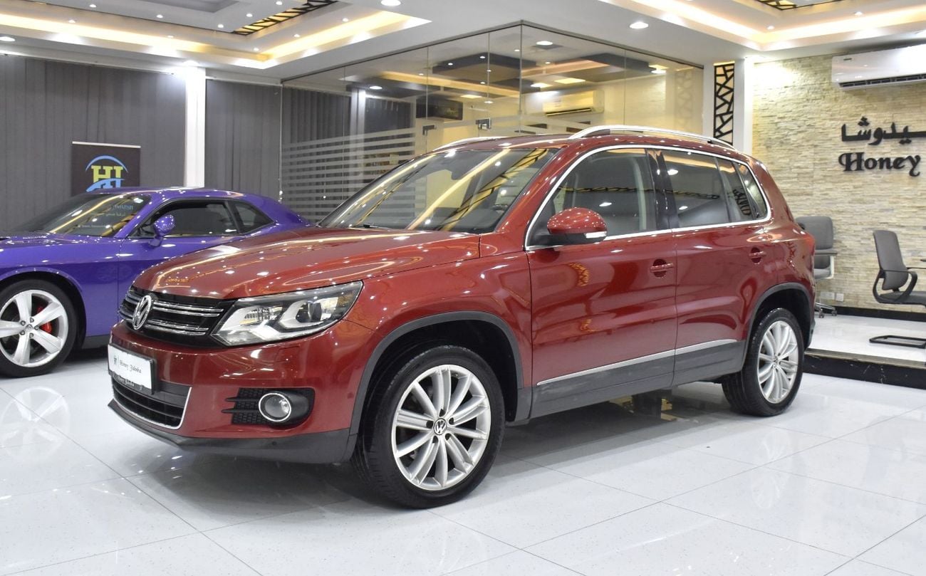 Volkswagen Tiguan SEL EXCELLENT DEAL for our Volkswagen Tiguan 2.0 TSi 4Motion ( 2014 Model ) in Red Color GCC Specs