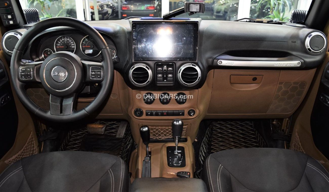 Jeep Wrangler Sahara EXCELLENT DEAL for our Jeep Wrangler UNLIMITED SAHARA 4x4 ( 2015 Model! ) in Brown Color! GCC