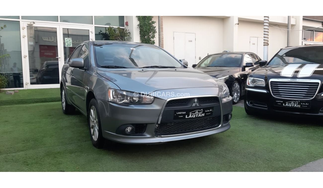 Mitsubishi Lancer Gulf gray color, inside beige without accidents, rear wing sensors, fog lights, in excellent conditi