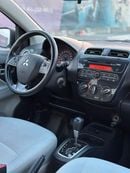 ميتسوبيشي اتراج GLX