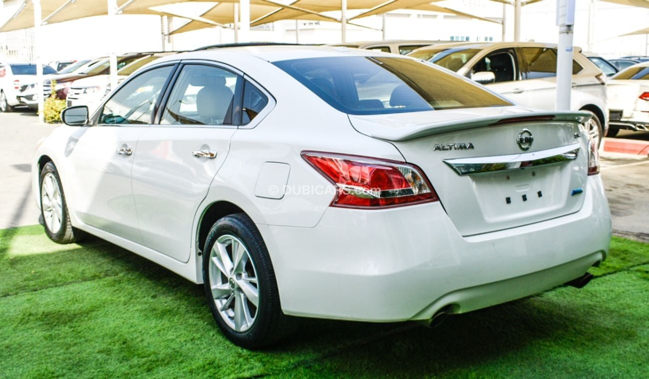 Nissan Altima White color inside Big Ward No.1 fingerprint slot, leather alloy wheels, camera screen control senso