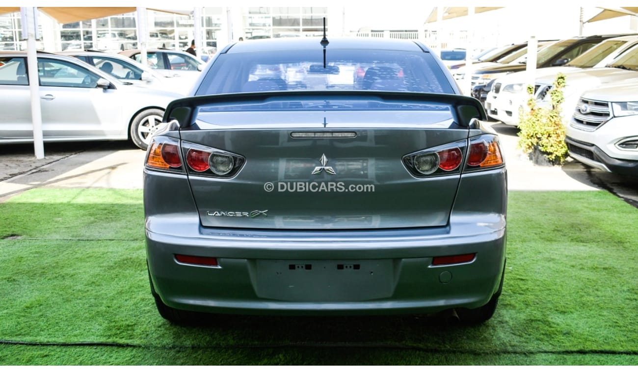 Mitsubishi Lancer Gulf gray color inside beige without accidents Rings rear wing sensors fog lights in excellent condi