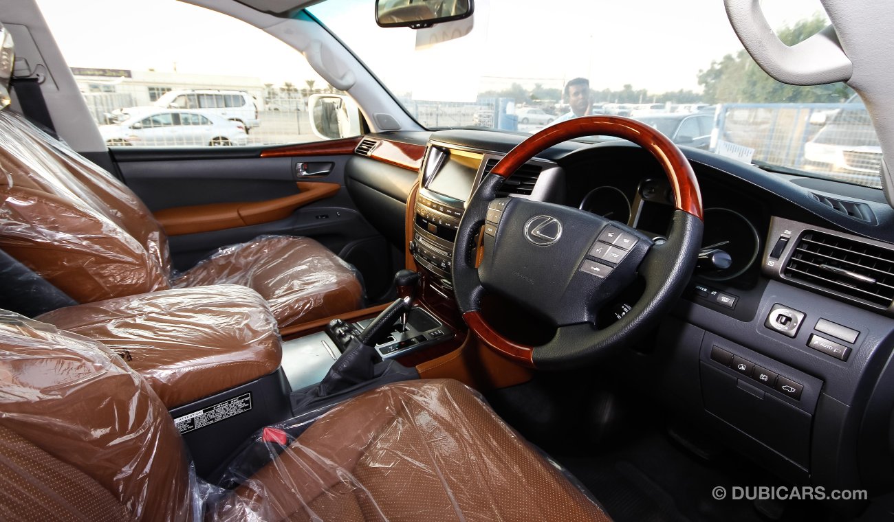 لكزس LX 570 FACELIFTED TO 2015 sports ( RIGHT HAND DRIVE ) ( EXPORT ONLY) pearl white with tan interior
