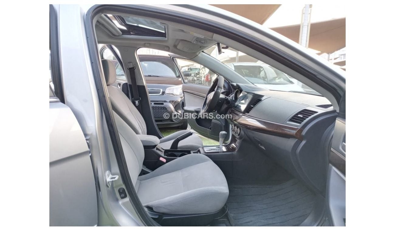 ميتسوبيشي لانسر 1600سى سى موديل 2009 خليجى فل أوبشن  خشب فتحة شاشة كاميرا خلفية بحالة ممتازة