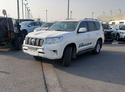 تويوتا برادو Toyota prado 2021Model 2.7 v4 petrol Engine Colour White Transmission Automatic Interior.Begie 7seat