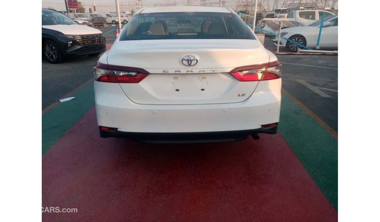 Toyota Camry LE 2022  White inside beige 2.5L petrol 4 Cylinder