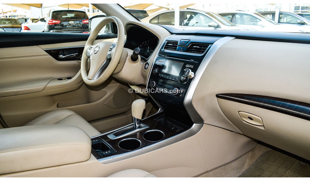 Nissan Altima White color inside Big Ward No.1 fingerprint slot, leather alloy wheels, camera screen control senso