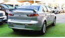 Mitsubishi Lancer 1600 CC, 2016 model, Gulf silver color, rear wing hatch, alloy wheels, FM radio, power conditioning,