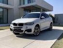 بي أم دبليو X6 AED 1,880 P.M | 0% DOWN PAYMENT | BMW X6 XDRIVE35I M KIT | AGENCY SERVICE HISTORY | 2019 | GCC SPECS