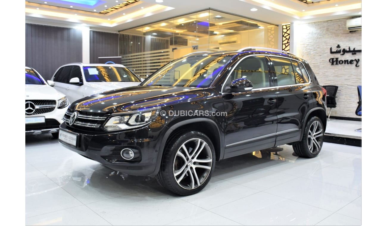 Volkswagen Tiguan SEL EXCELLENT DEAL for our Volkswagen Tiguan 2.0 TSi 4Motion ( 2014 Model! ) in Black Color! GCC Spe