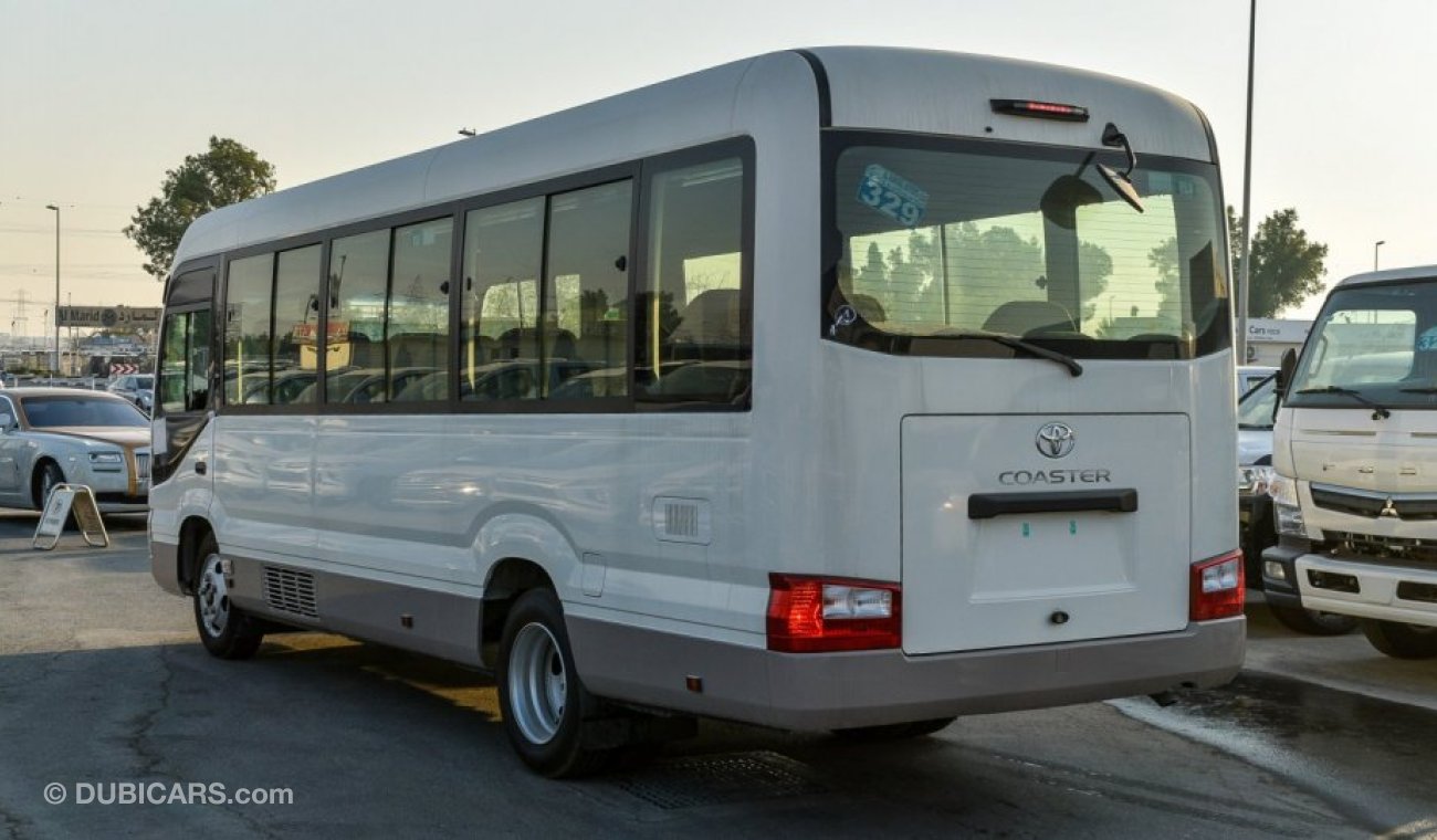 Toyota Coaster 4.2L V6 M/T Diesel 23 passengers - 16″ wheels - brown interior