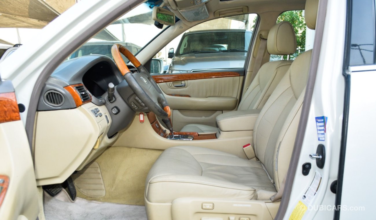 Lexus LS 430 Imported 1/2 Ultra 2006 model, white color, leather opening, wood wheels, electric mirrors, electric