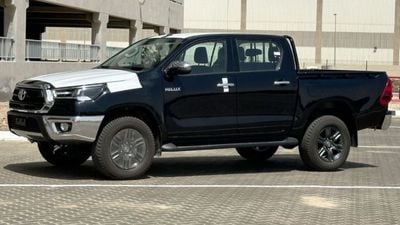 Toyota Hilux 2.7L V4  4*4 Automatic • Black Rims & Red Interior