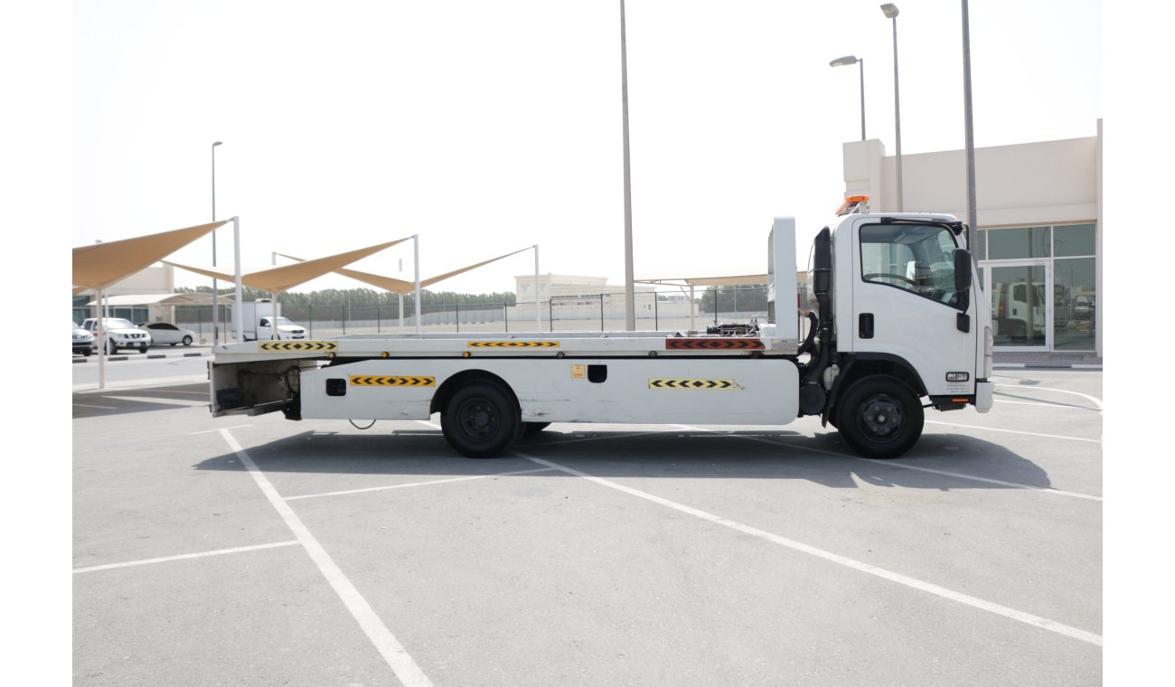 Used Isuzu NPR FULL DOWN FLAT BED RECOVERY TRUCK 2016 for sale in Dubai