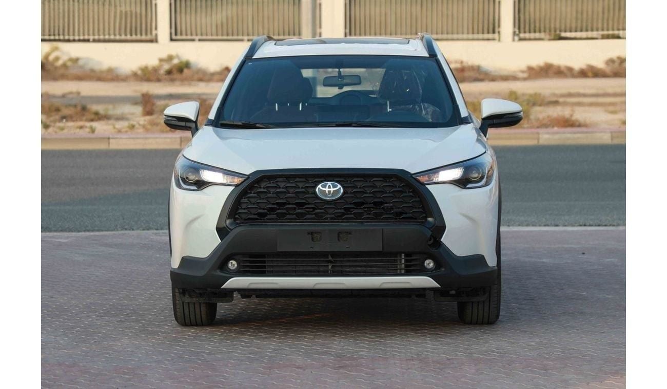 تويوتا كورولا كروس 2024 TOYOTA COROLLA CROSS 1.8 Hybrid MID - PLATINUM WHITE PEARL inside RED | Export Only
