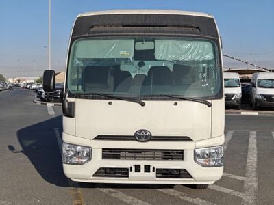 تويوتا كوستر 4.2L V6 DIESEL | 23 STR | M/T | AUTO  DOOR | LUGGAGE RACK| MY2026
